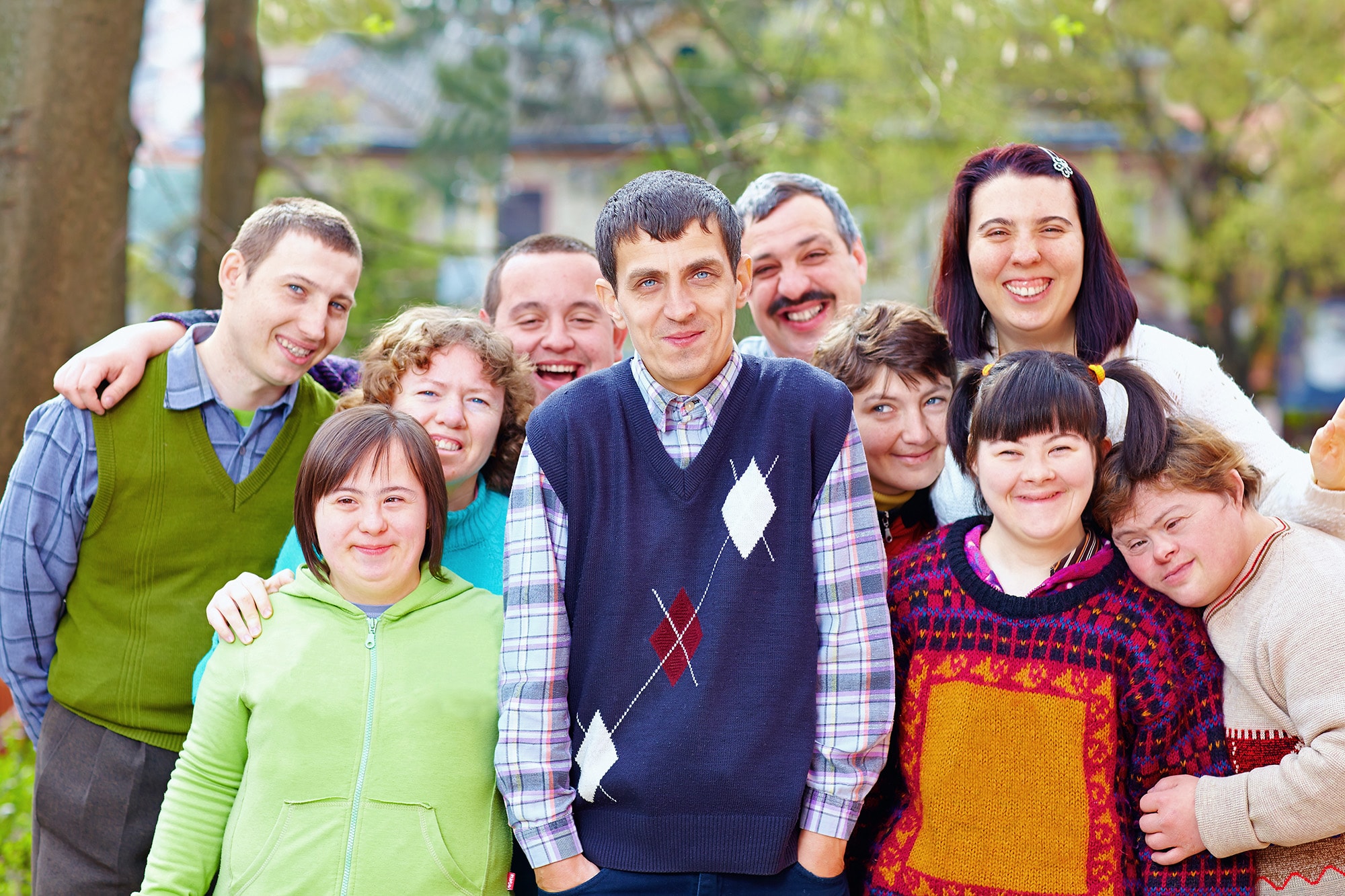 Individuals and staff together in an Essential for Living community program